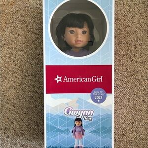 American Girl Gwynn Tan Doll in Purple Dress